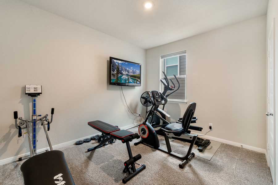 K&H technician servicing home fitness equipment