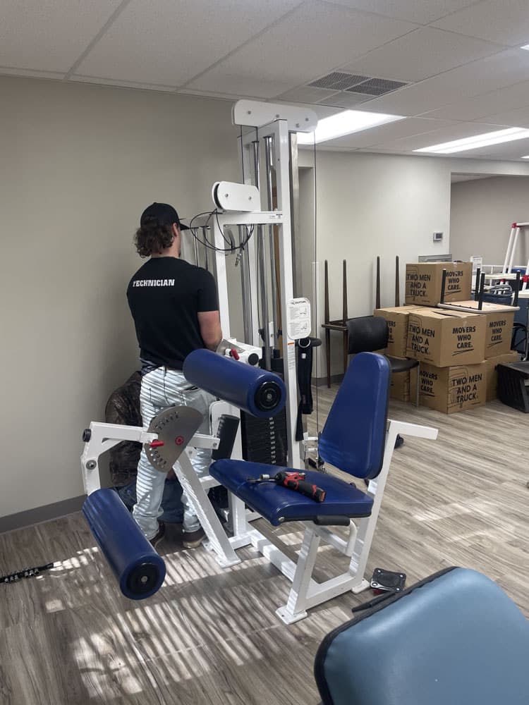 K&H certified technician repairing home fitness equipment